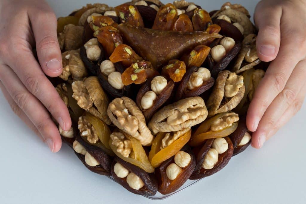 host-ready platter of stuffed dates snack with nuts and dried fruit