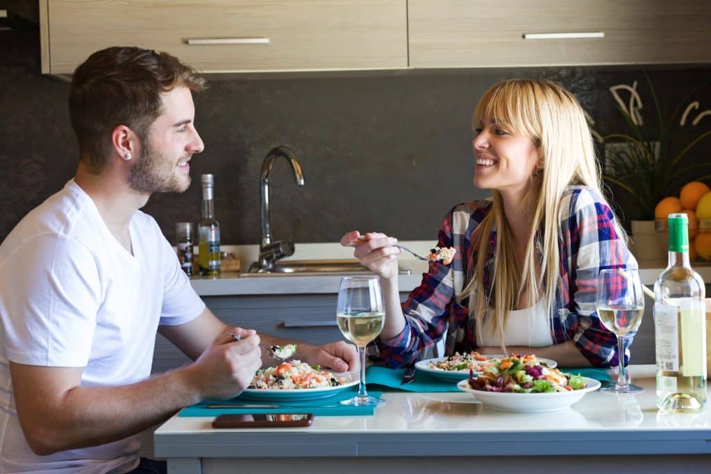 Couple enjoying healthy grain-based meal linked to magnesium foods anxiety support