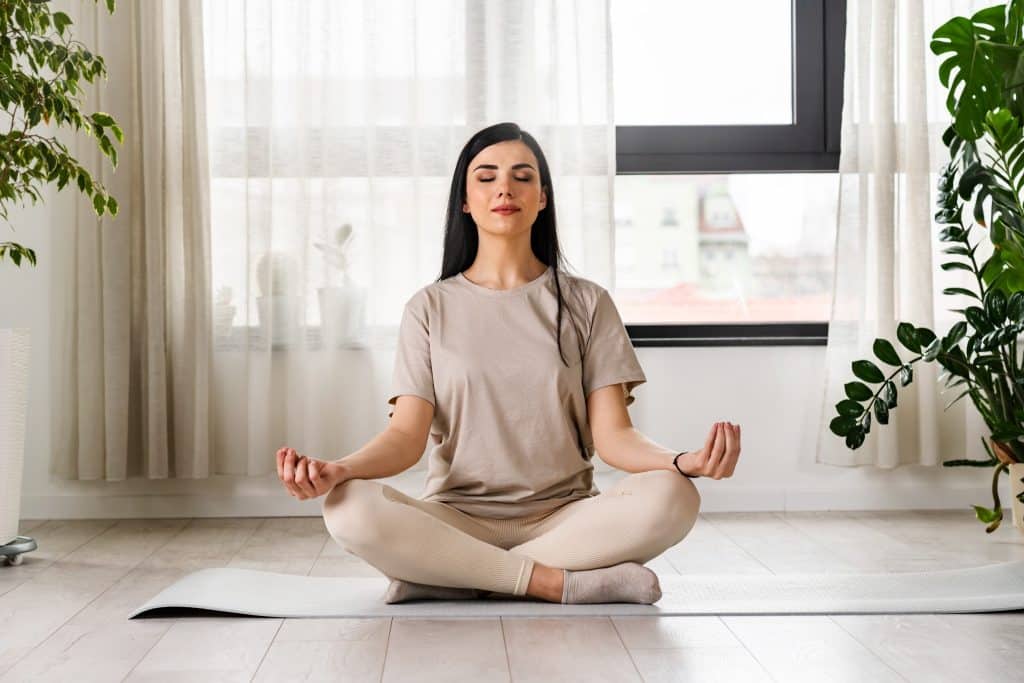 woman meditating for calm mood with psychobiotics for anxiety
