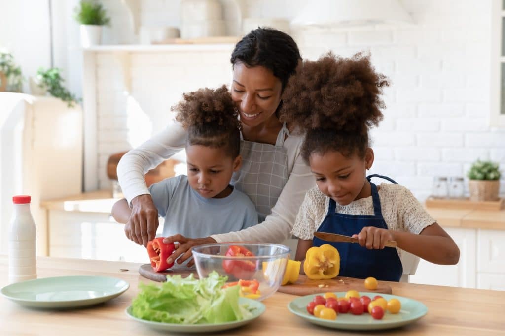 family preparing vegetables and healthy meals for gut health and anxiety