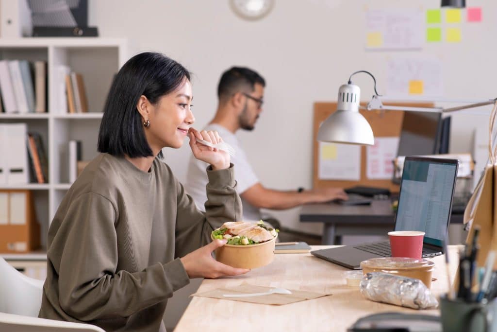 Office worker eating a simple lunch at a desk