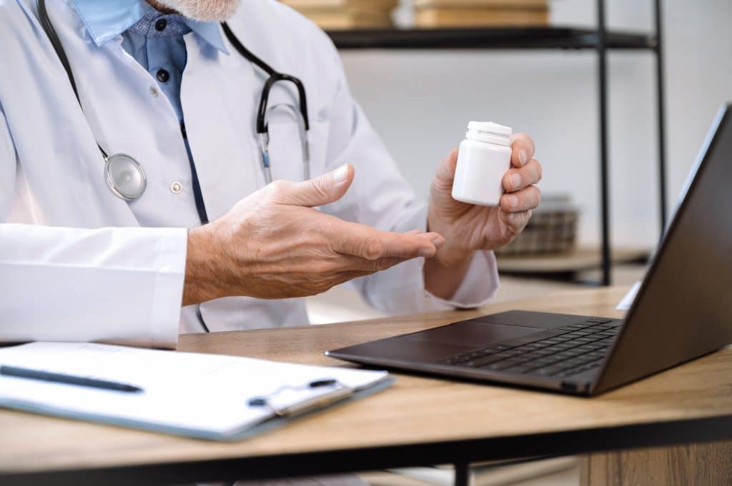 Doctor explaining a supplement bottle on video call for saffron depression guidance