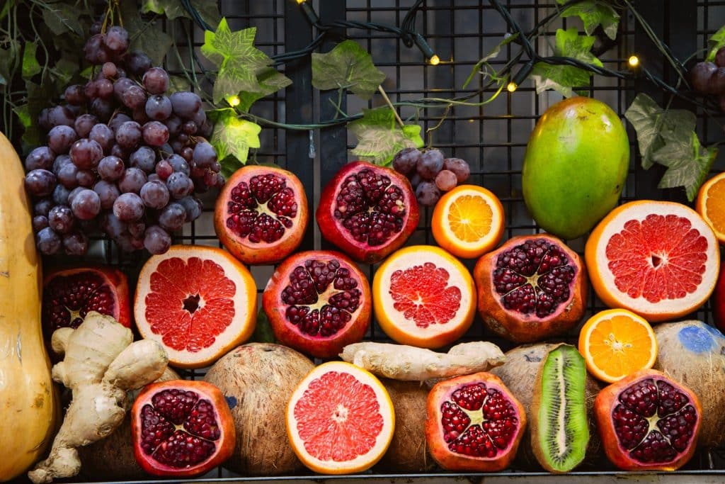 Colorful mix of fruits, ginger, and citrus linked to immunity, capturing how the food choices pandemic encouraged healthier eating trends.