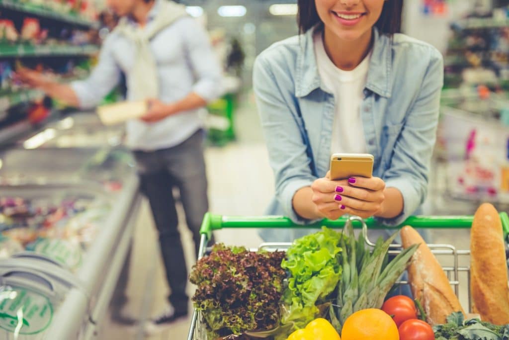 Couple shopping for fresh produce.