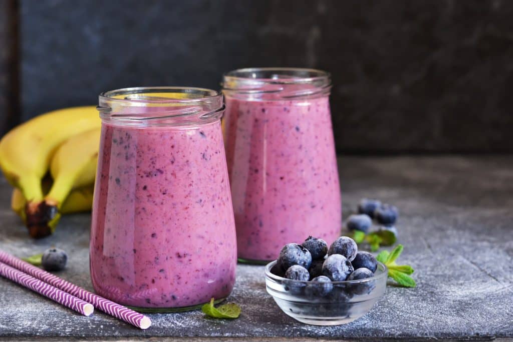 Berry kefir smoothie highlighting postbiotics gut health benefits in a daily diet