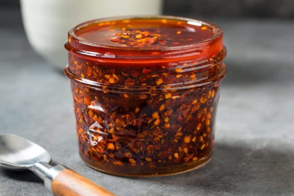 lass jar of chili crisp trend on kitchen counter