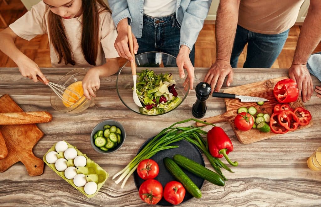 Family cooking colorful vegetables high in polyphenols in health