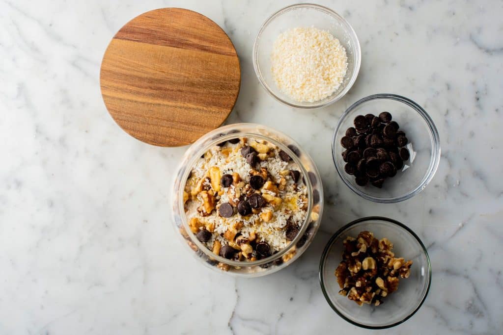 Mixing bowl with oats, nuts, and chocolate chips