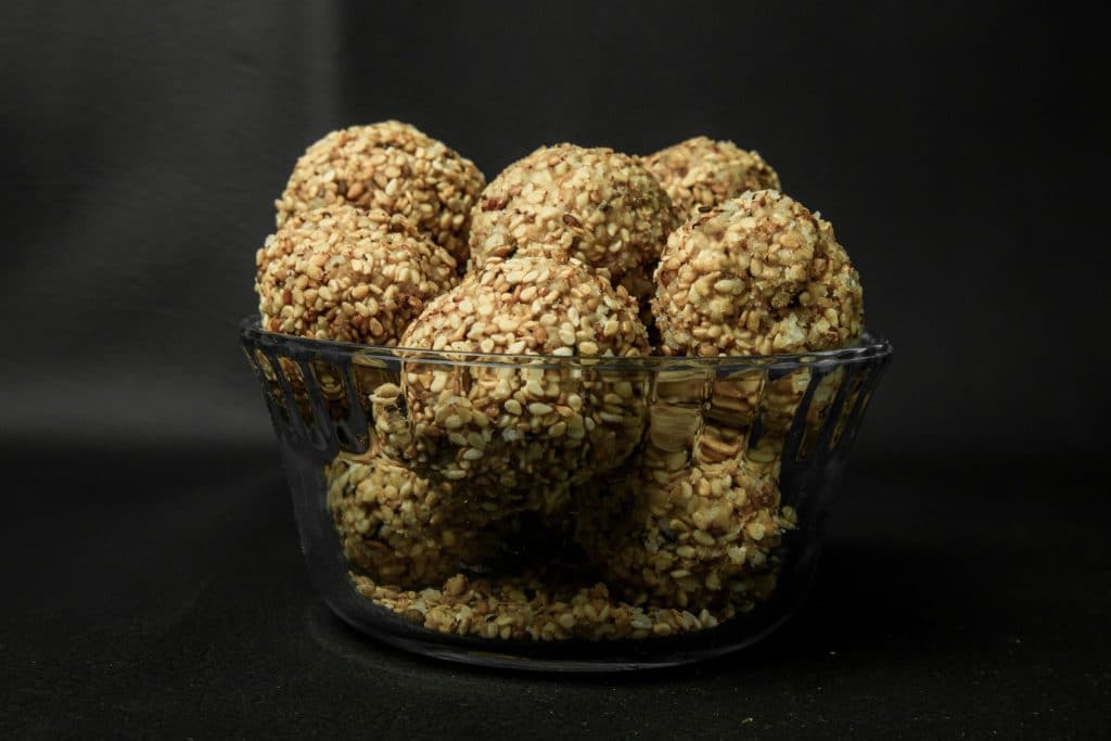 Sesame coated protein balls in glass bowl