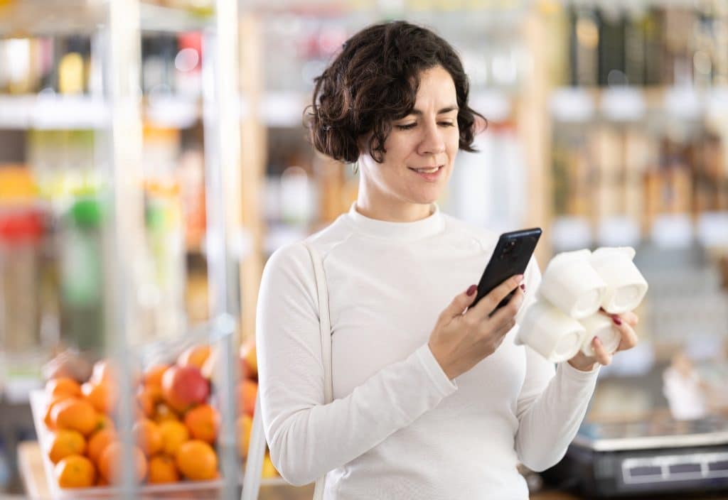regenerative agriculture foods shopper scanning sourcing QR code on yogurt
