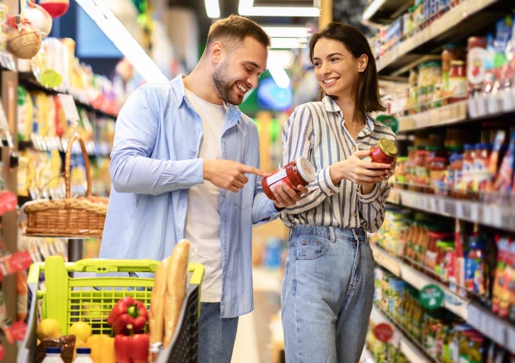 regenerative agriculture foods couple reading jar labels in supermarket